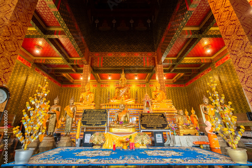 The gold Buddha statue in the temple at Wat Tham Chariya Phirom, Samut Sakhon, Thailand