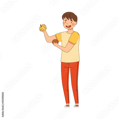 Young Man Holding Tomato and Bell Pepper Vegetable as Source of Vitamin and Energy Vector Illustration