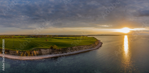 Fototapeta Naklejka Na Ścianę i Meble -  Panorama aerial view of sunset on the steep coast of the Baltic Sea.