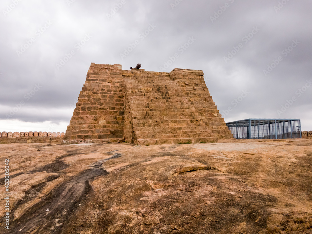 The stone bastion of the ancient Thirumayam Fort on a rocky hill. The stone bastion of the ancient Thirumayam Fort on a rocky hill.