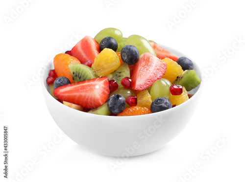 Fresh delicious fruit salad in bowl on white background