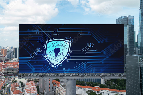 Padlock icon hologram on road billboard over panorama city view of Singapore at day time to protect business, Southeast Asia. The concept of information security shields.