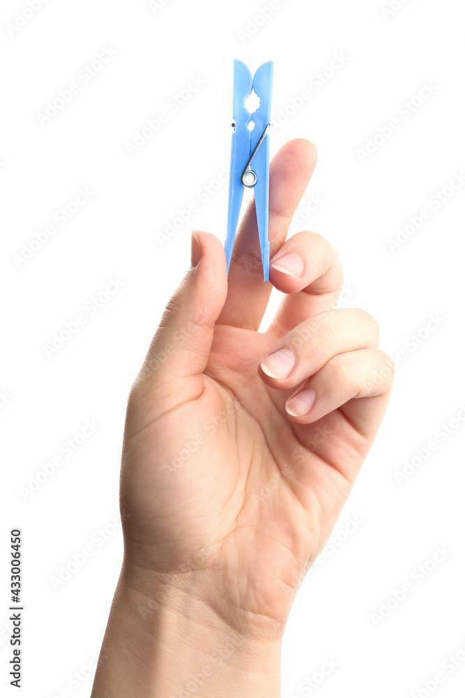 Woman holding light blue plastic clothespin on white background, closeup Woman holding light blue plastic clothespin on white background, closeup