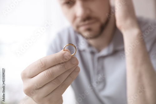 Man with wedding ring, closeup. Cheating and breakup