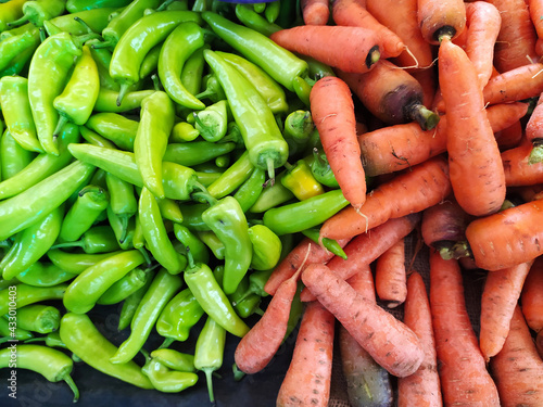 Fresh carrots and banana pepper at the asian market - Stock photo