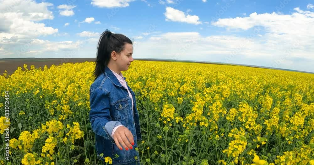 Girl Walking In Amazing Field Of Yellow Rapeseed In The Countryside - slow motion Girl Walking In Amazing Field Of Yellow Rapeseed In The Countryside - slow motion