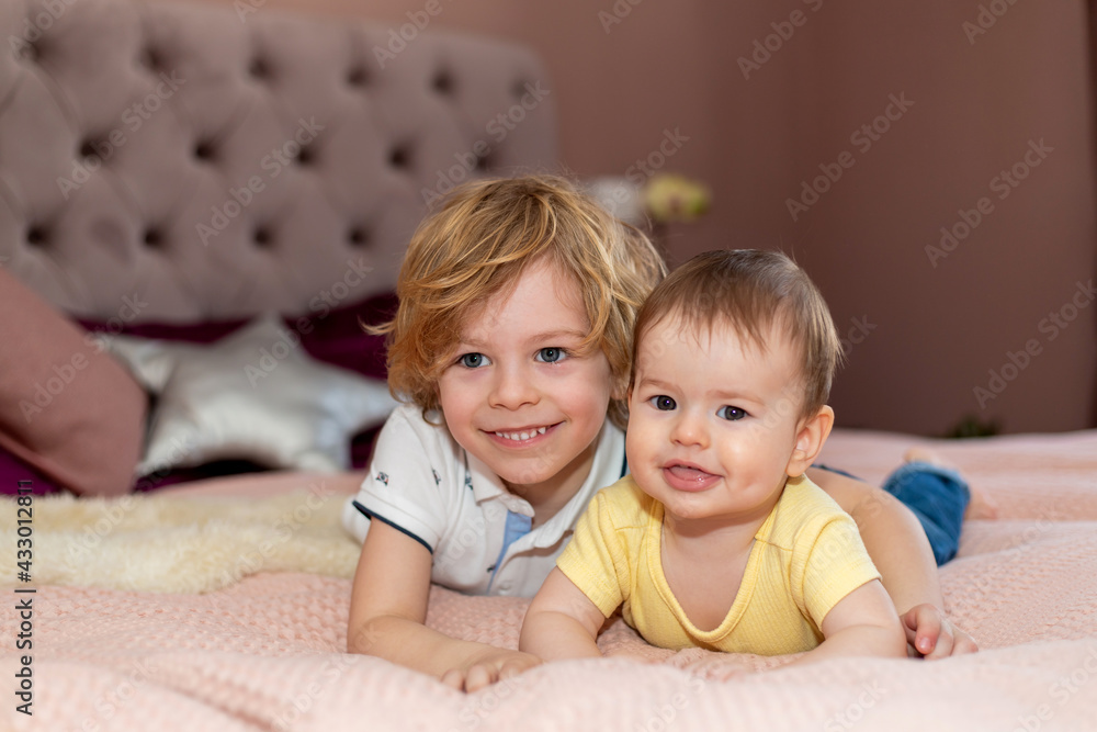 Portrait of two brothers smiling in their room. Portrait of two brothers smiling in their room.