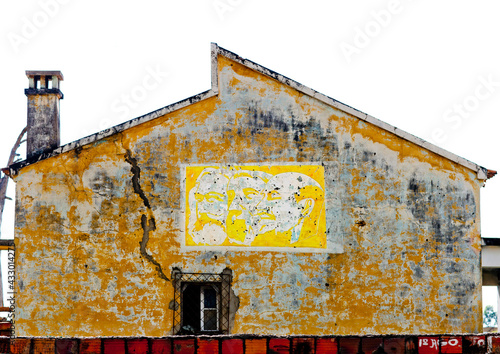 Old Communist Propaganda On The Facade Of A House In Lubango, Angola photo