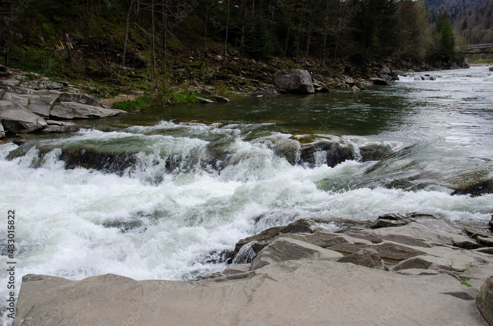 Mountain forest river water landscape. Waterfall in Carpathian Mountains, Ukraine. Mountain forest river water landscape. Waterfall in Carpathian Mountains, Ukraine.
