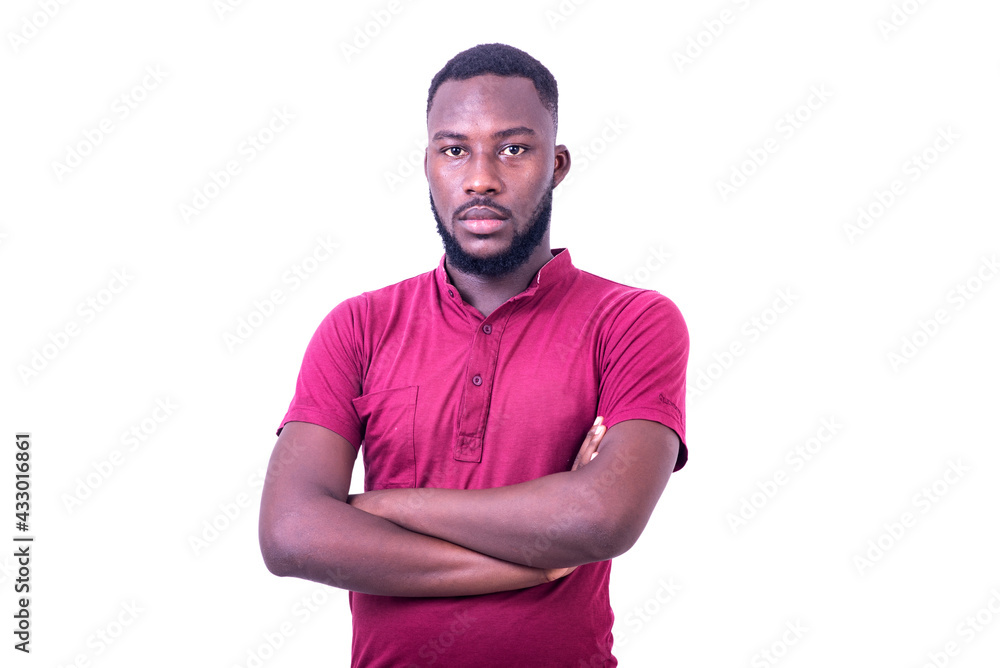 handsome serious young man crossing his arms.