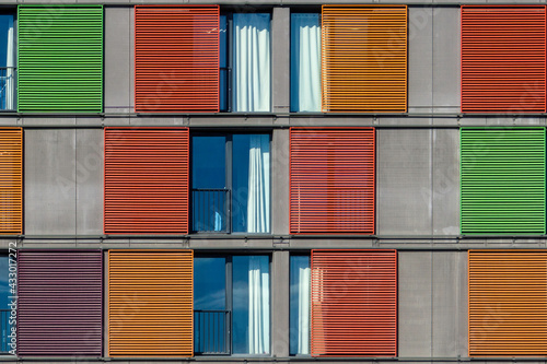 Colourful Sliding Blinds on a Modern Building.