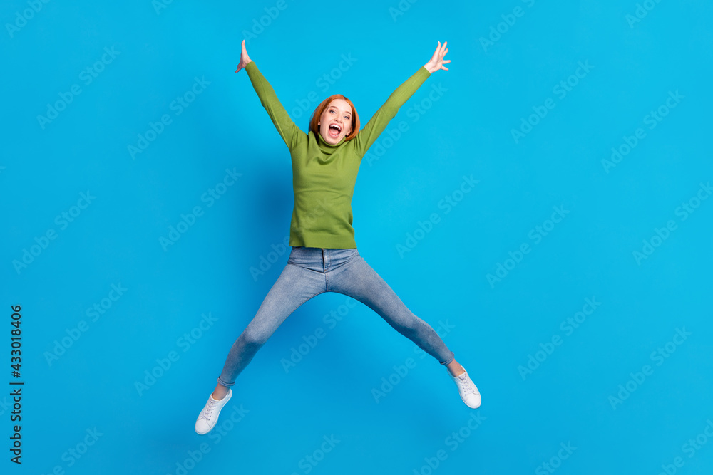 Fototapeta premium Full length body size view of pretty carefree cheerful girl jumping having fun good mood isolated over bright blue color background