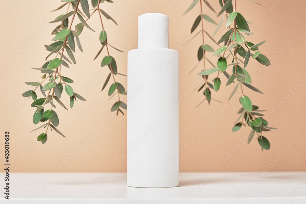 Cosmetics beauty mockup. White bottle on pastel background Cosmetics beauty mockup. White bottle on pastel background