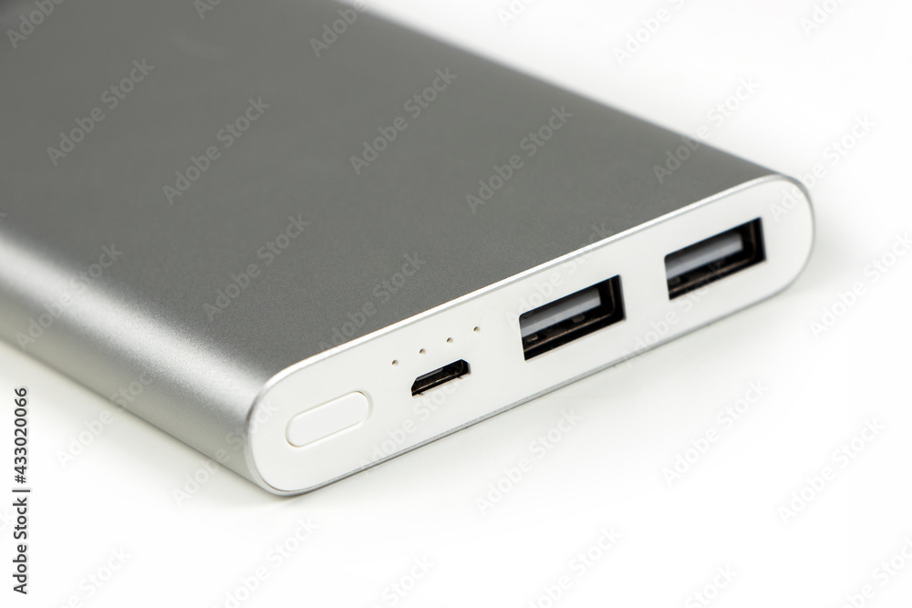 Power bank for charging mobile devices. White smart phone charger with power bank battery bank . External battery for mobile devices. Power bank for charging mobile devices. White smart phone charger with power bank battery bank . External battery for mobile devices.