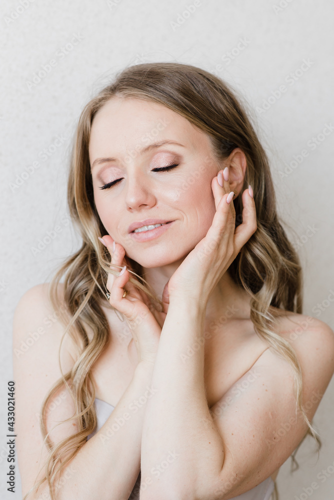 Fototapeta premium light makeup on a beautiful young girl close-up