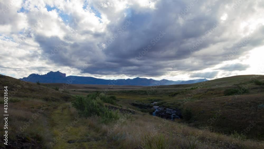 Time lapse of clouds over mountains and stream at Highmoor in Maloti Drakensberg Time lapse of clouds over mountains and stream at Highmoor in Maloti Drakensberg
