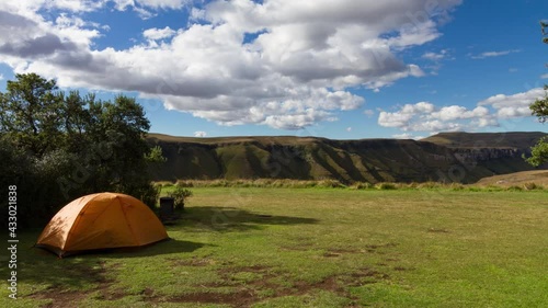 Time lapse Clouds over tent in campsite in Drakensberg looking at mountains photo
