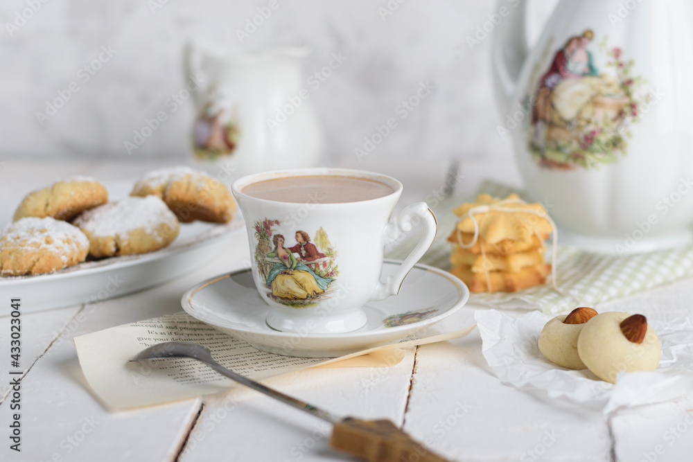 My sister spill the milk on chocolate hot drink to prepare breakfast with Eid Cookies which is called Kahk.
My sister spill the milk on chocolate hot drink to prepare breakfast with Eid Cookies which is called Kahk.