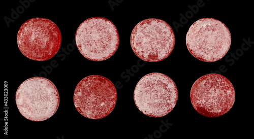 Sour cherry bonbons, candy set and collection isolated on black background, top view