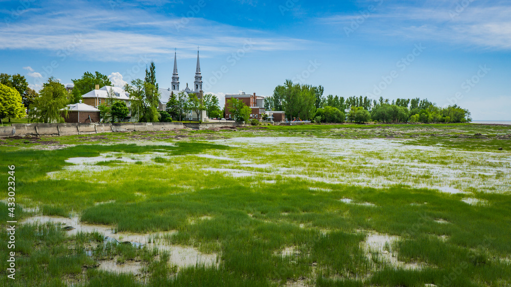 View on L'Islet, a small town of Quebec (Canada) along the touristic route 132 and the foreshore of the St Lawrence river at low tide View on L'Islet, a small town of Quebec (Canada) along the touristic route 132 and the foreshore of the St Lawrence river at low tide