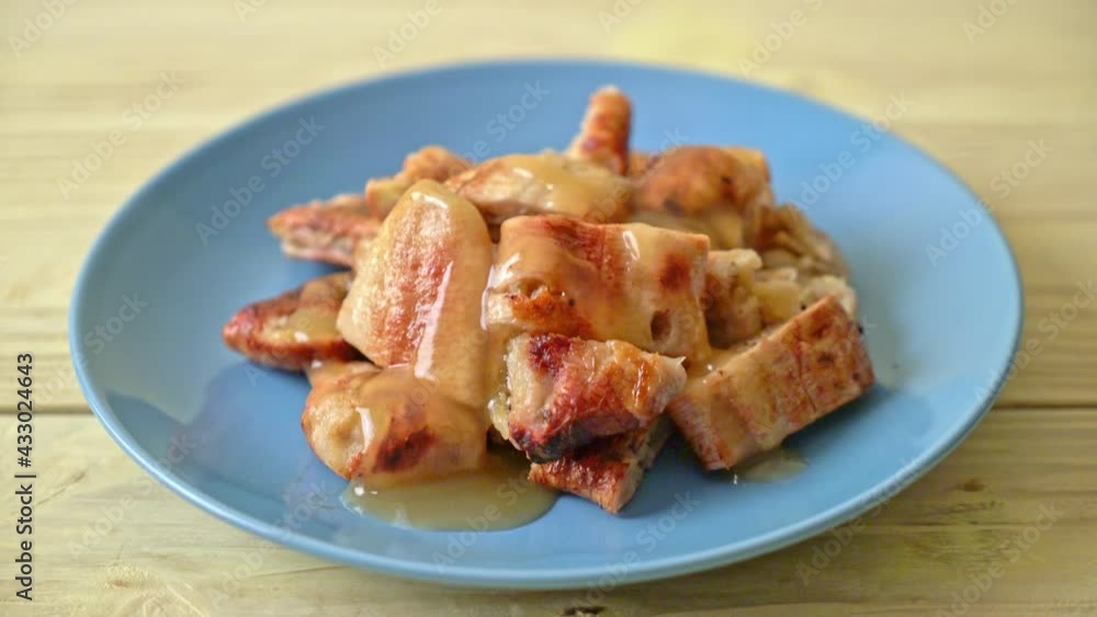 grilled bananas with coconut caramel sauce on plate grilled bananas with coconut caramel sauce on plate