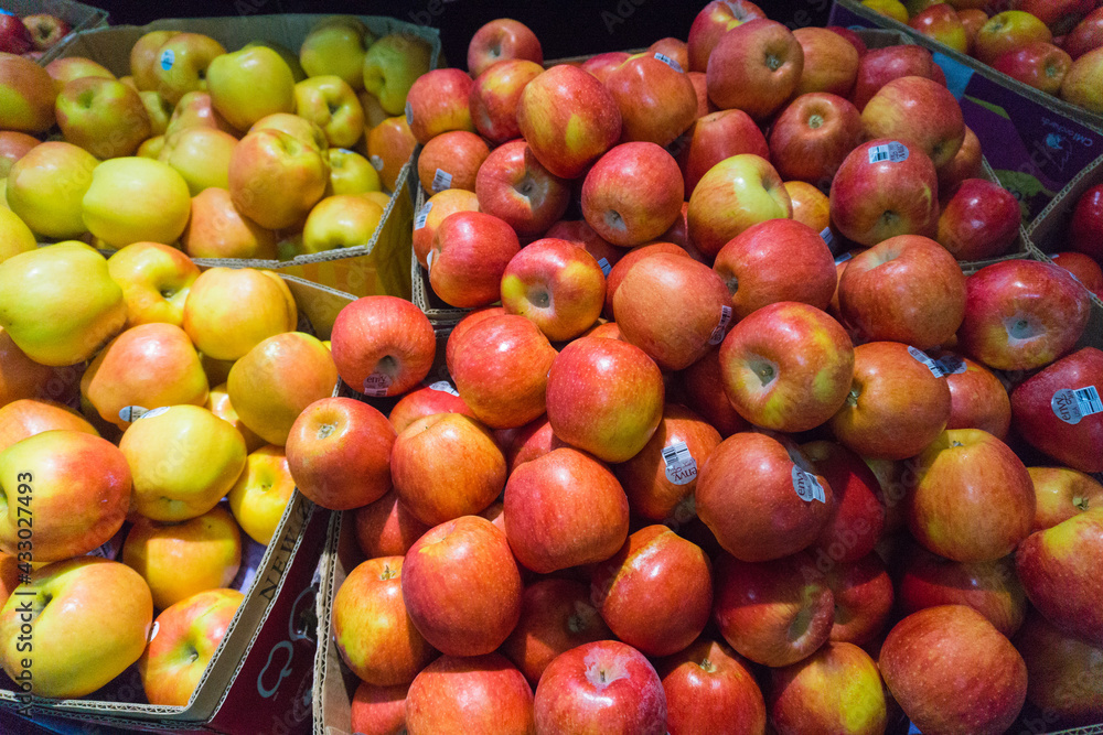 Baskets of fresh and succulent apples for sale in supermarkets
