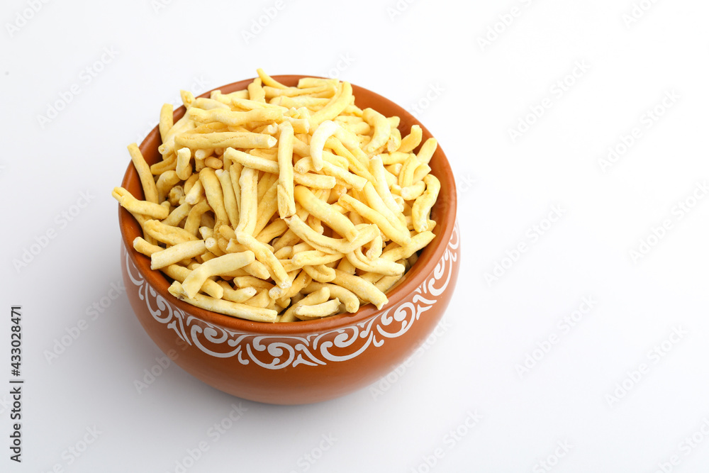 Bhavnagari Gathiya is a very popular Gujarati snack, brown bowl on