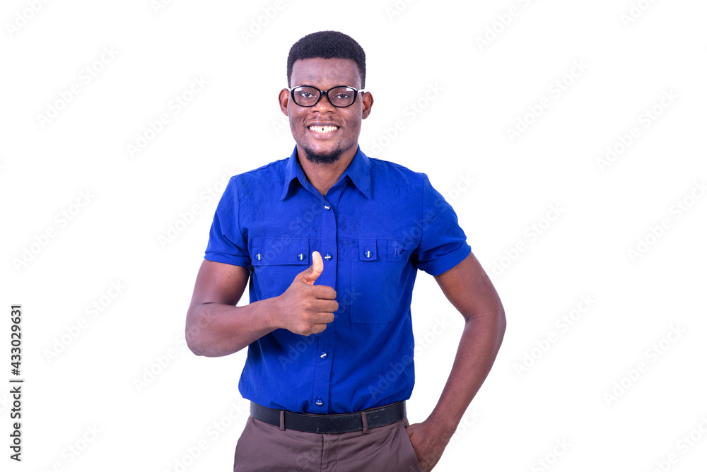 young happy man showing his thumb while smiling. young happy man showing his thumb while smiling.