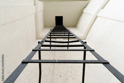 tall metal ladder going up - POV