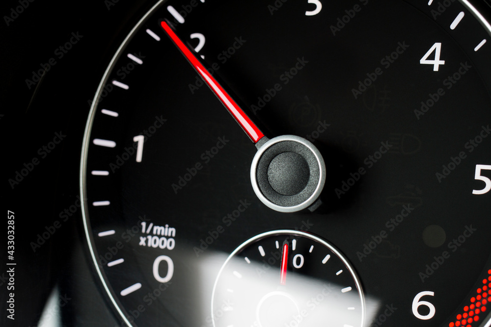 Close-up of a black tachometer in a car