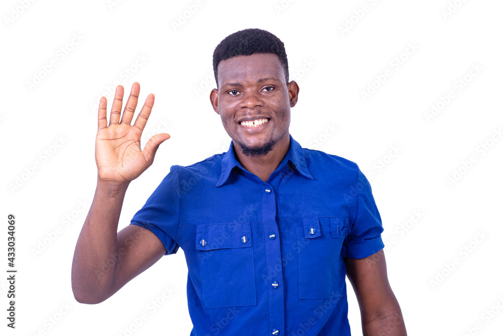 young happy businessman saluting while smiling. young happy businessman saluting while smiling.