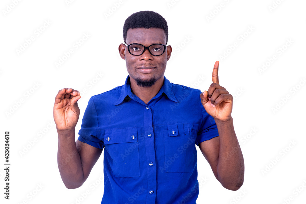 young businessman pointing finger up smiling. young businessman pointing finger up smiling.