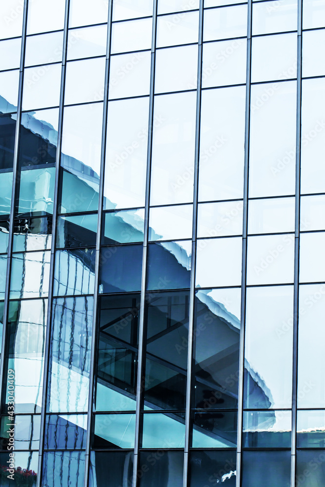 Reflection of skyscrapers on glass window of modern tower, architecture background Reflection of skyscrapers on glass window of modern tower, architecture background