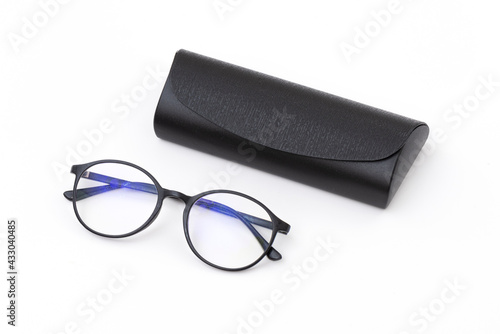 Stylish modern fashionable elegant black eyeglasses in black plastic case.