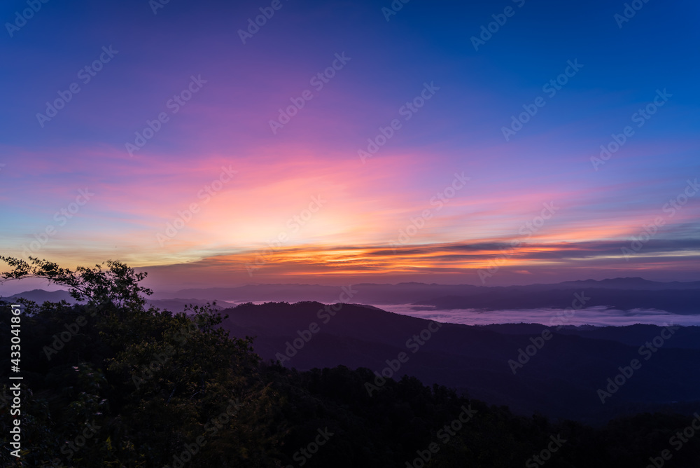 morning view with twilight sky on the top of the mountain names Doi swang or Phu Snan, Doi Phu Kha national park, Nan Province along the Luang Prabang Range in North Thailand