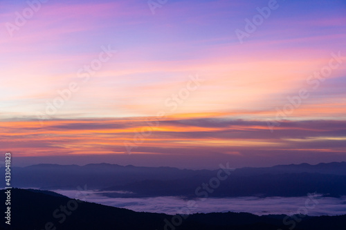 morning view with twilight sky on the top of the mountain names Doi swang or Phu Snan, Doi Phu Kha national park, Nan Province along the Luang Prabang Range in North Thailand