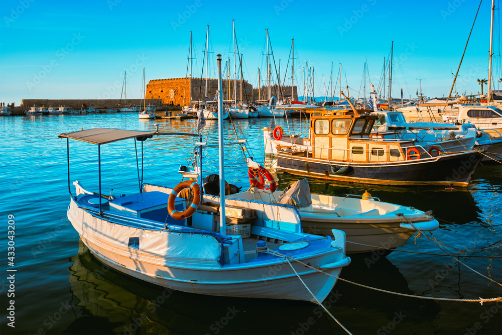 Venetian Fort in Heraklion and moored fishing boats, Crete Island, Greece Venetian Fort in Heraklion and moored fishing boats, Crete Island, Greece