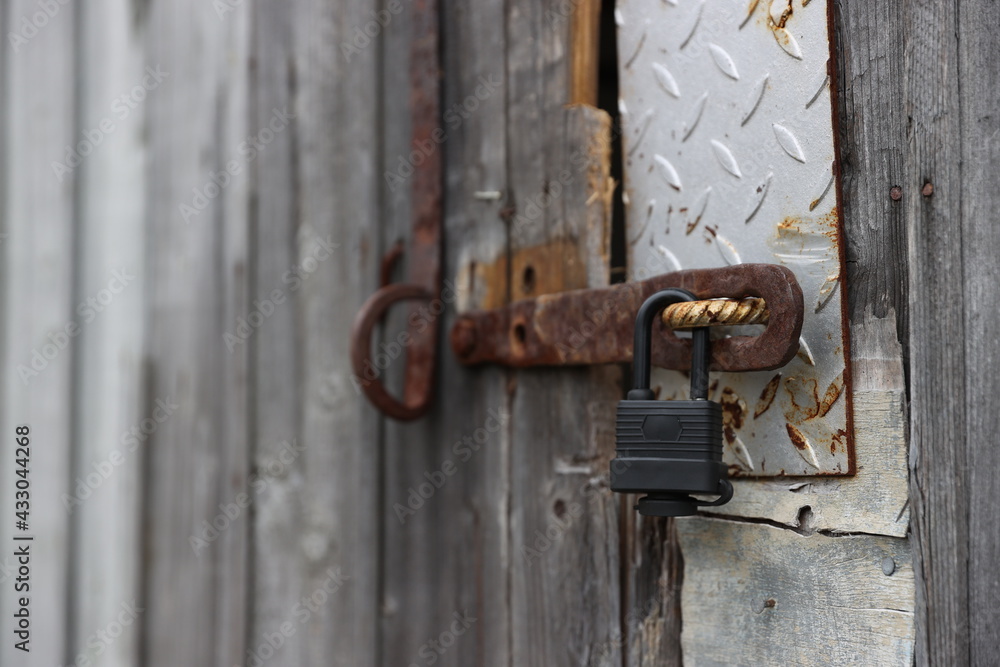 old padlock on the door old padlock on the door