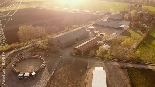 aerial of a farm ranch at sunset