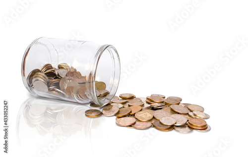 bank and scattered coins on a white background