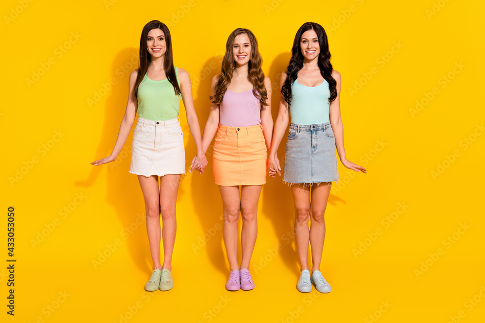 Full size photo of young happy cheerful lovely girls wear short skirts