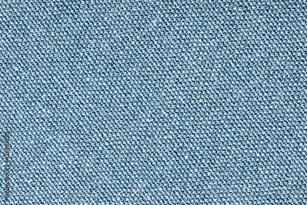 Blue wool sweater fabric. Closeup textile texture. Apparel clothes. Casual wear. Knit pattern. Warm winter fiber material. Cotton background. Blue wool sweater fabric. Closeup textile texture. Apparel clothes. Casual wear. Knit pattern. Warm winter fiber material. Cotton background.