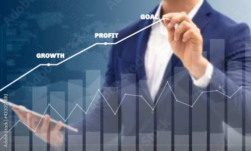 Growth success developments to goals concept. Businessman forecast analysis plan profit chart with pen and increase of positive indicators. Graph business stock turnover financial plan year. 