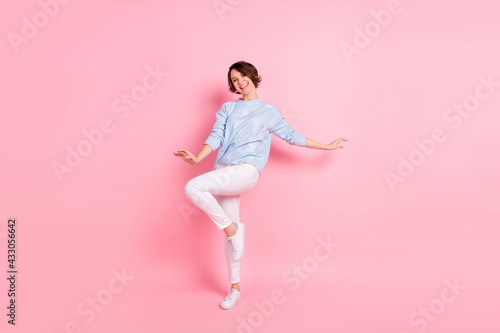 Full size photo of young beautiful charming lovely dreamy girl dancing enjoying weekend isolated on pink color background
