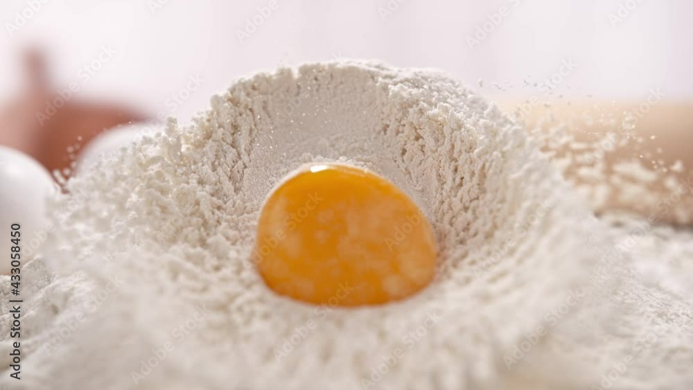 Egg Yolk Falling and Rolling Down the Pile of White Flour in Slow Motion 1000 FPS Egg Yolk Falling and Rolling Down the Pile of White Flour in Slow Motion 1000 FPS