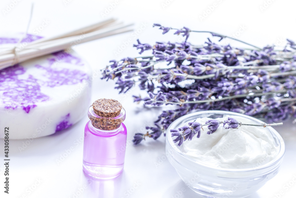 organic cosmetic with lavender flowers and oil on white background organic cosmetic with lavender flowers and oil on white background