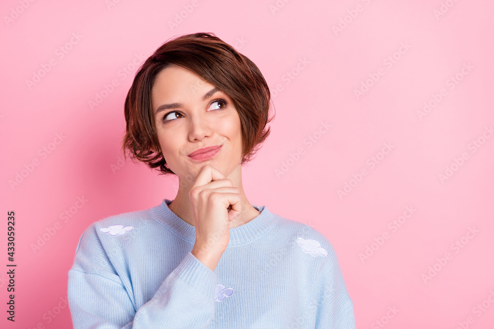 Photo of pretty positive girl arm finger on chin look interested empty space isolated on pink color background Photo of pretty positive girl arm finger on chin look interested empty space isolated on pink color background