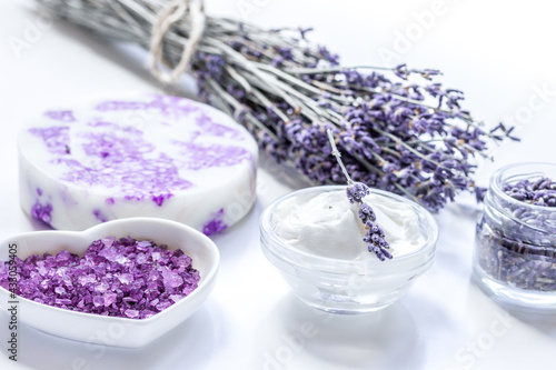 body cream with lavender herbs cosmetic white background