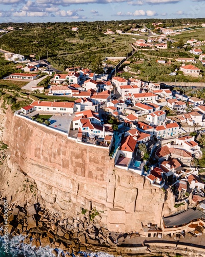 Aerial view of Azenhas do Mar, a small township along the wild Portuguese coastline facing the Atlantic Ocean, Colares, Portugal.