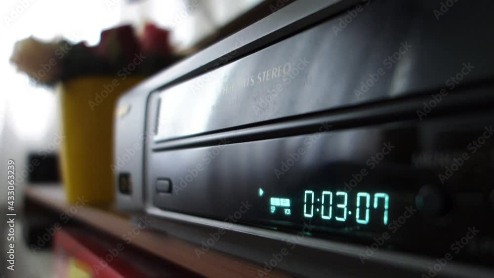 VCR timer display, Video cassette recorder playing VCR timer display, Video cassette recorder playing